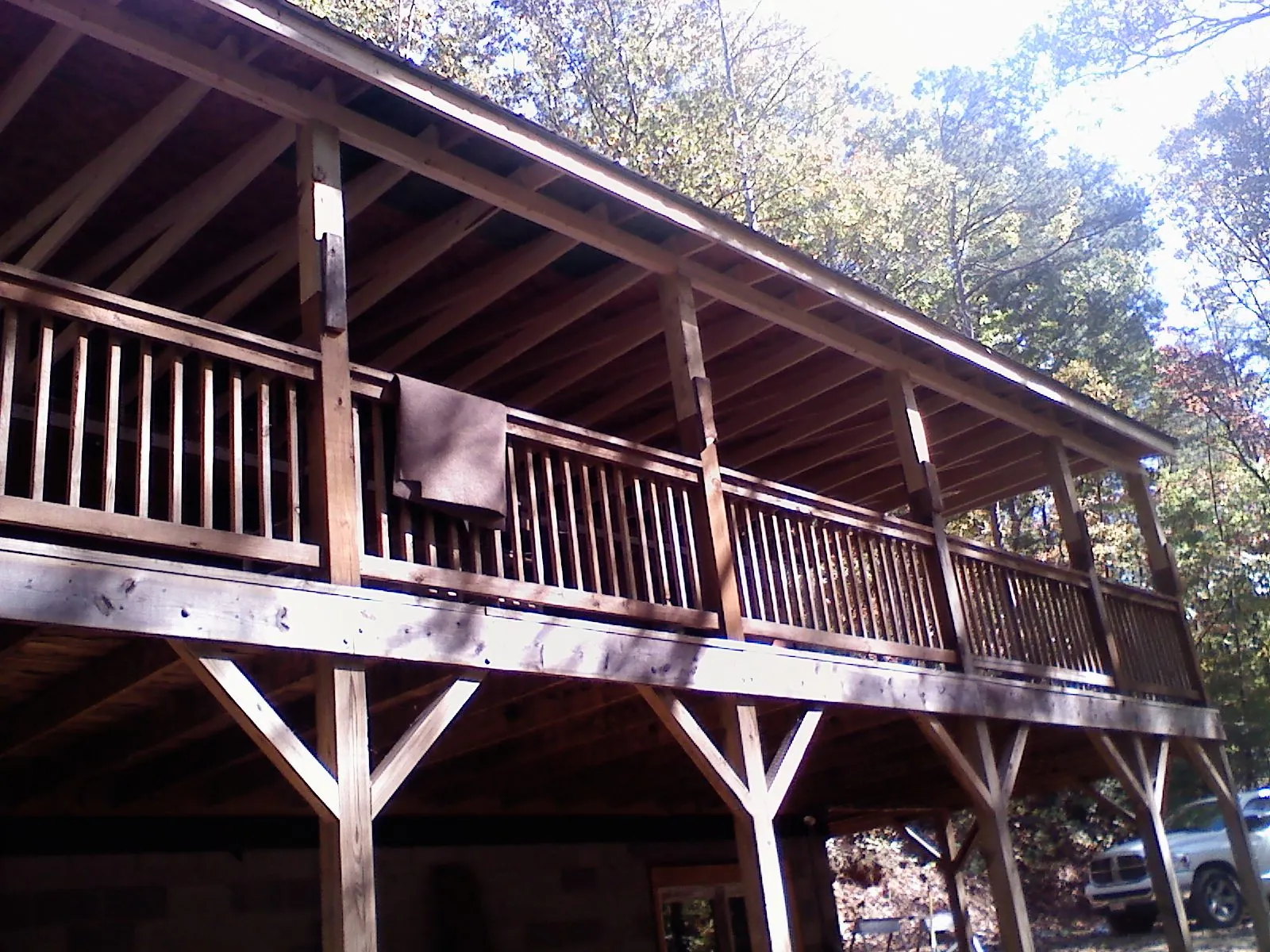 Timber framing under a new elevated porch and deck — Roof Leak Repair in Wyoming by Roofing Brothers